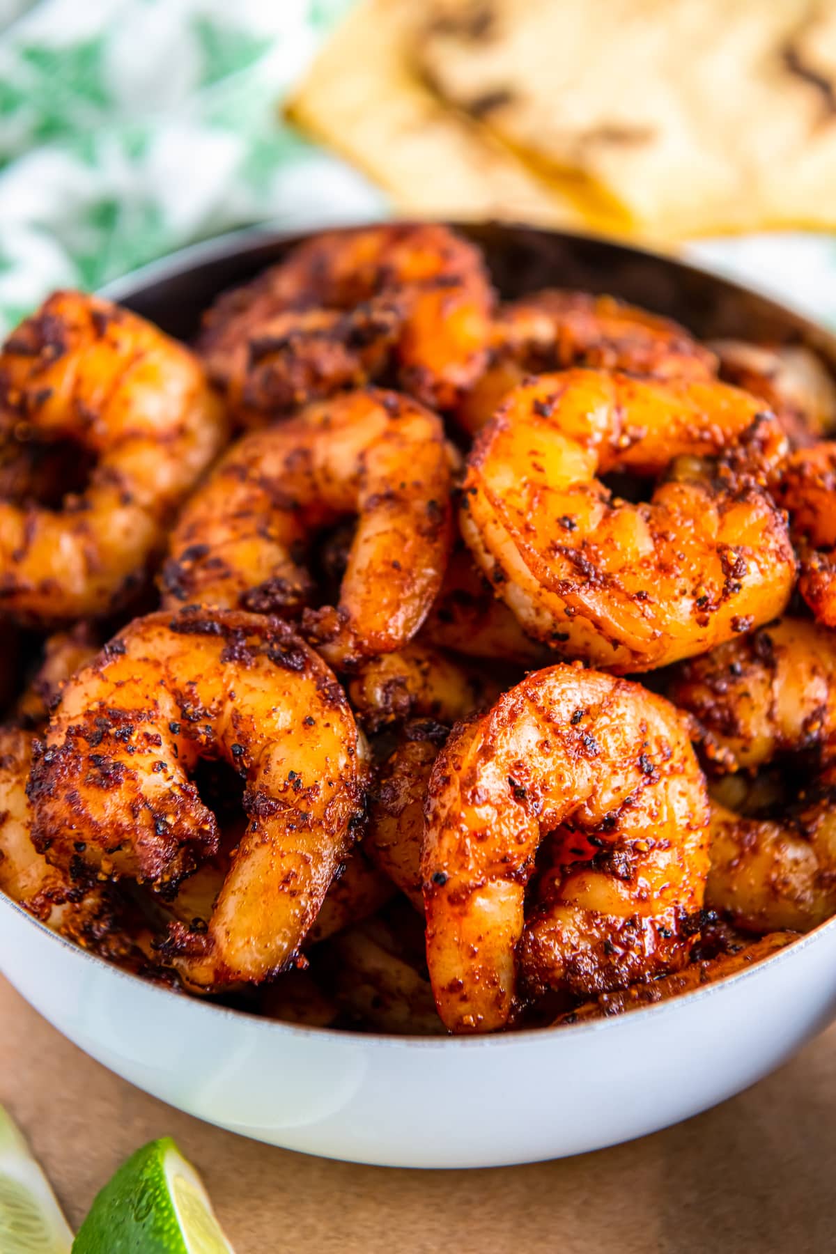 Cooked and seasoned shrimp in a bowl.