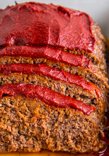 Slices of meatloaf with sauce.