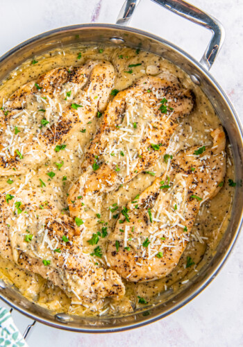 A skillet of garlic chicken parmesan.