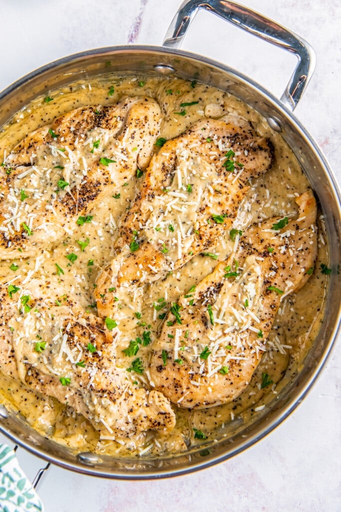 A skillet of garlic chicken parmesan.