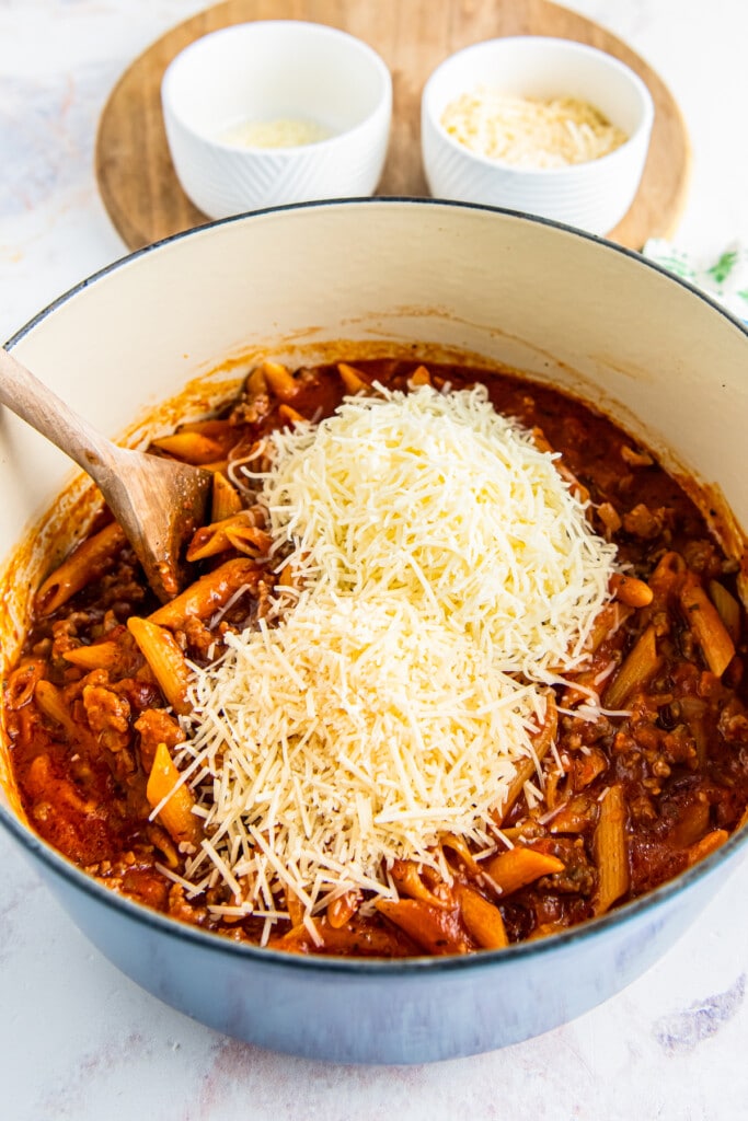 Cheese is added to the pasta dish.