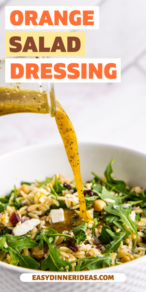Orange dressing being poured into an orzo and arugula salad.