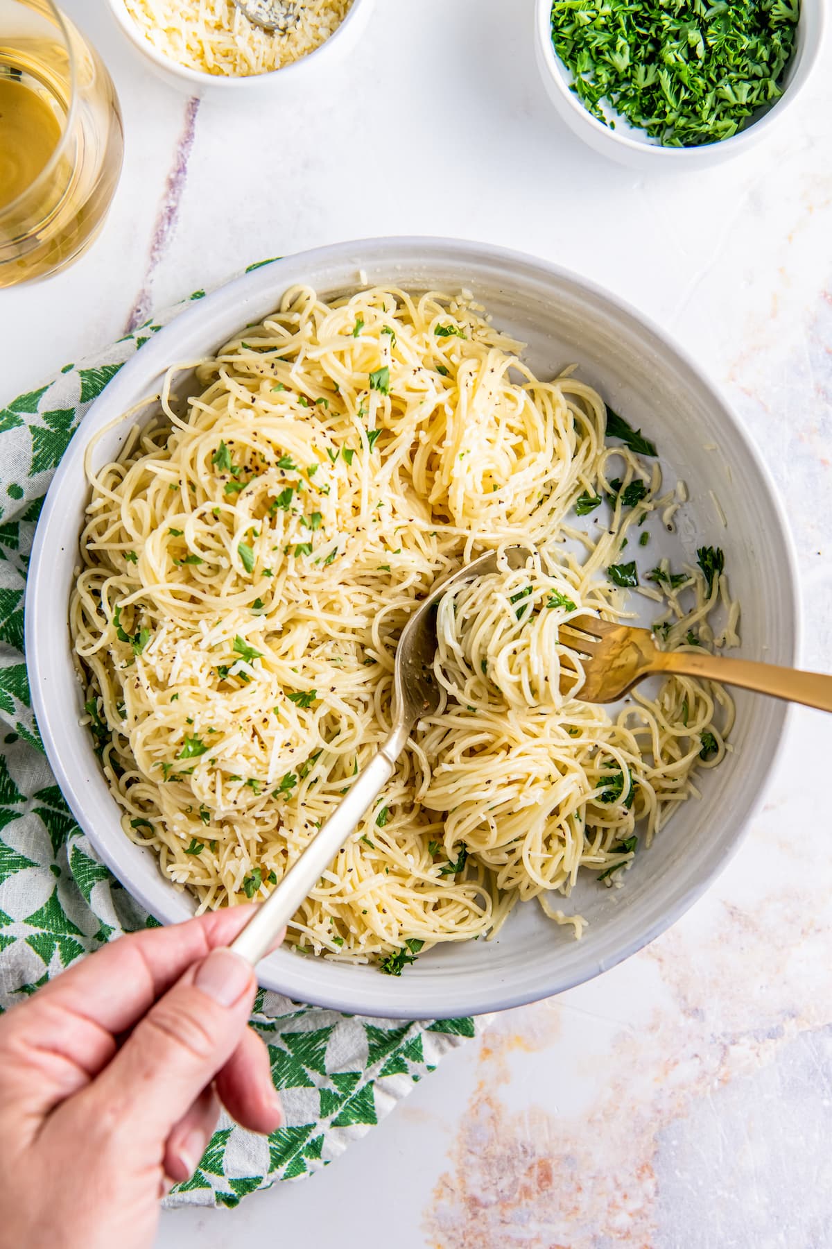 A bowl of buttery noodles is ready to eat.