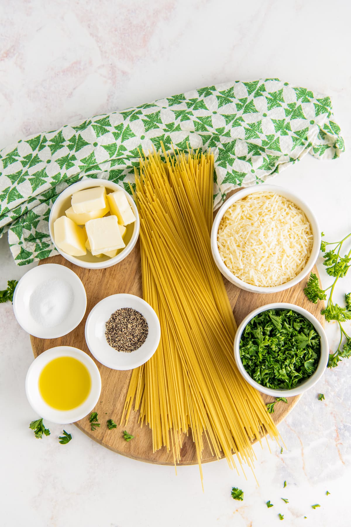 Ingredients needed to make Parmesan butter noodles.
