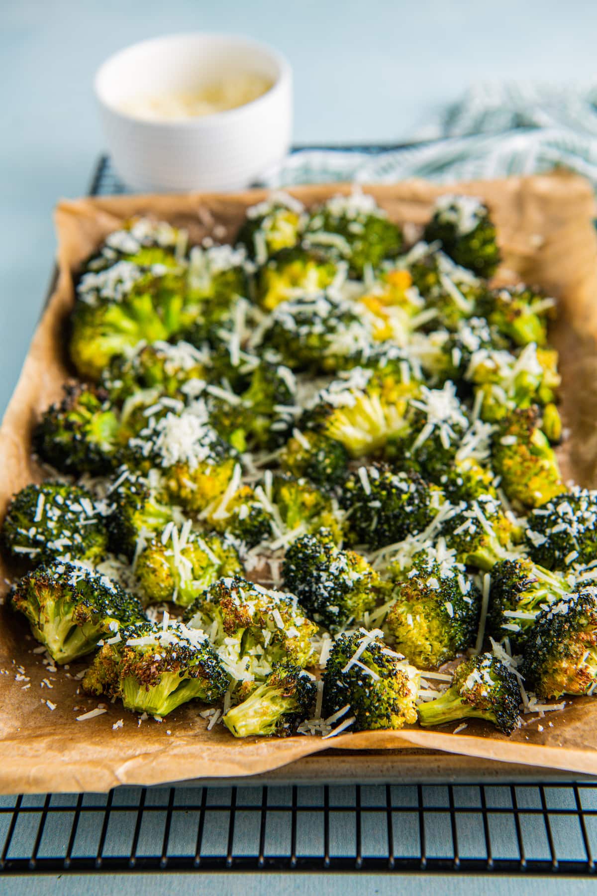 Parmesan cheese tops roasted broccoli.