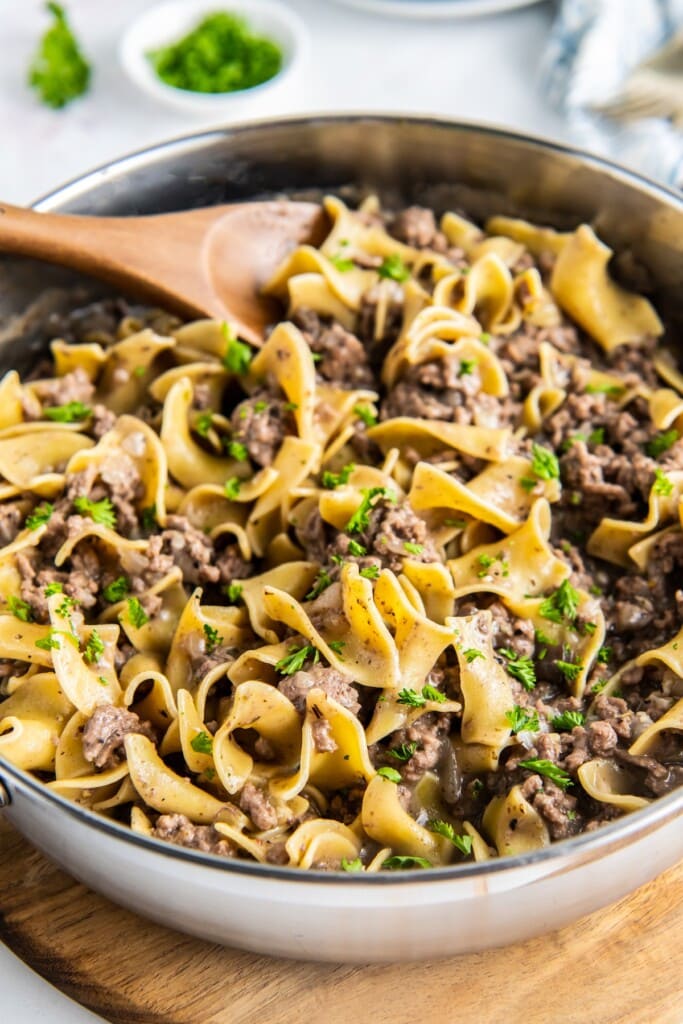 Beef and noodles in a skillet.