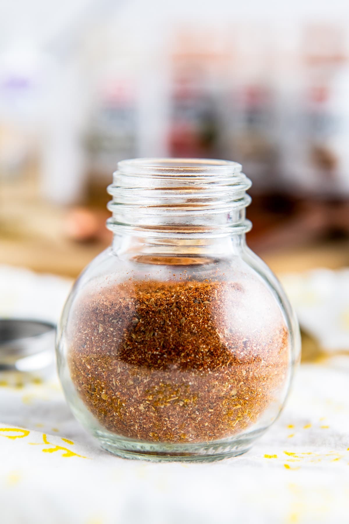 Jar filled with DIY chicken taco seasoning.