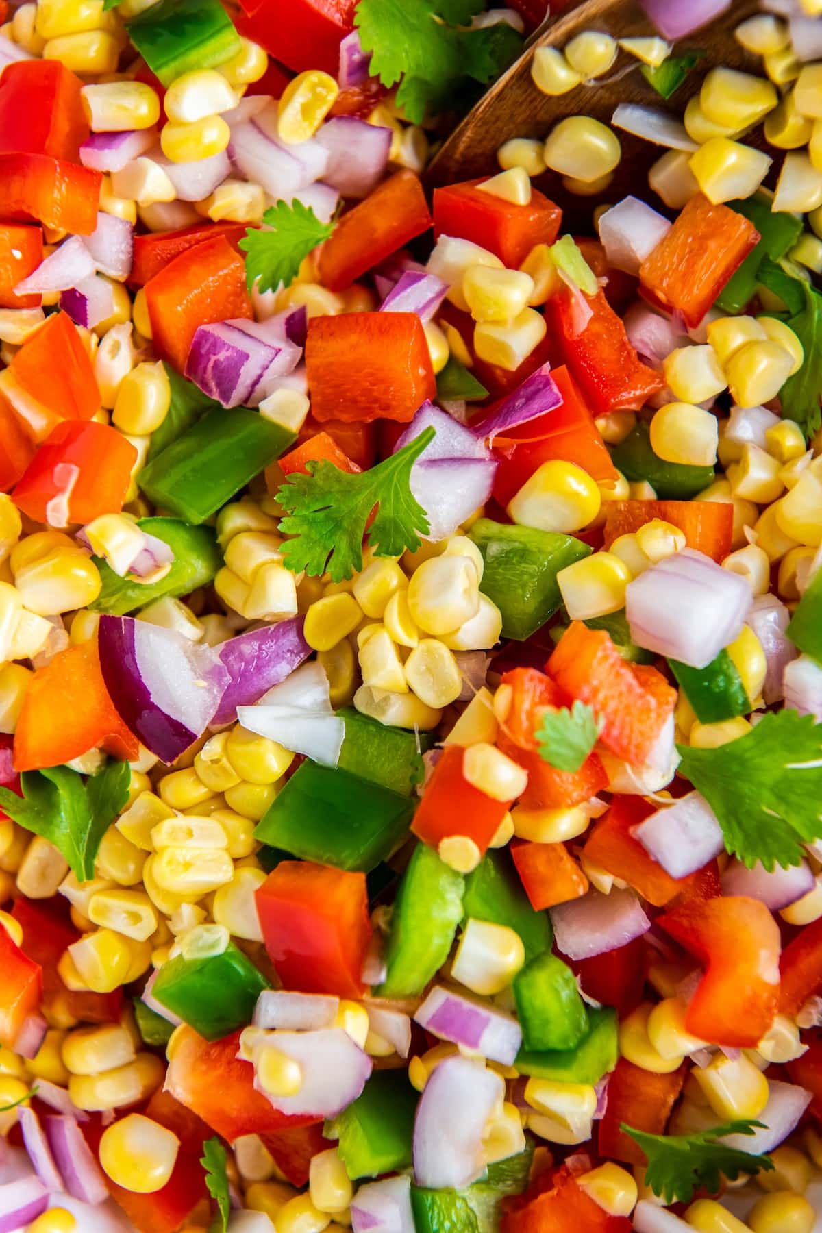 Fresh corn salsa with chopped bell pepper.