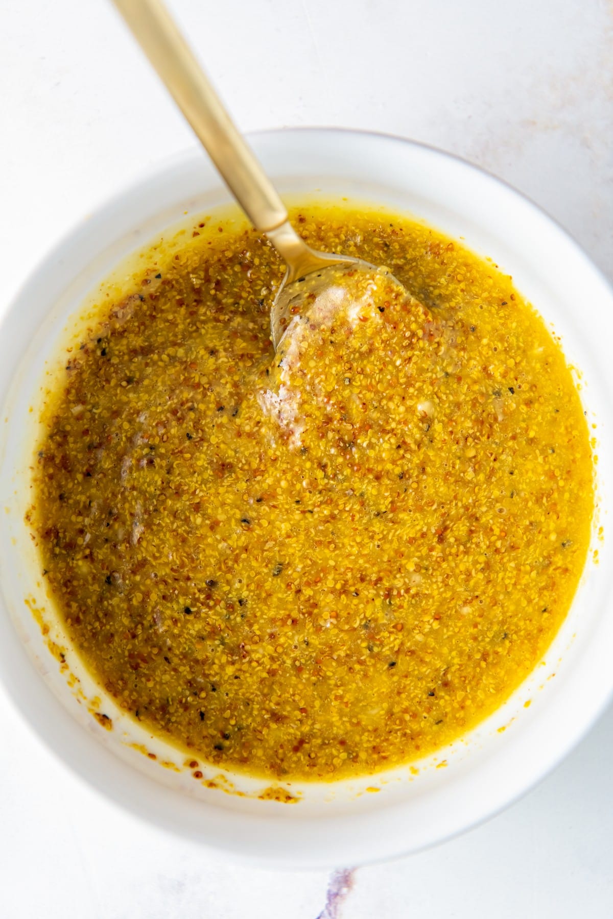 Dijon mustard dressing with olive oil and lemon juice.