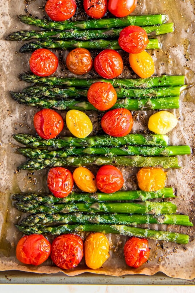 Roasted asparagus with roasted cherry tomatoes.