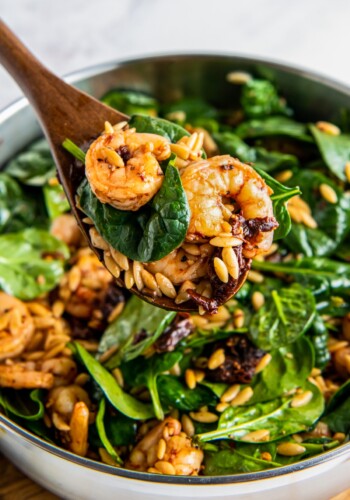 Sautéed shrimp with orzo and spinach.