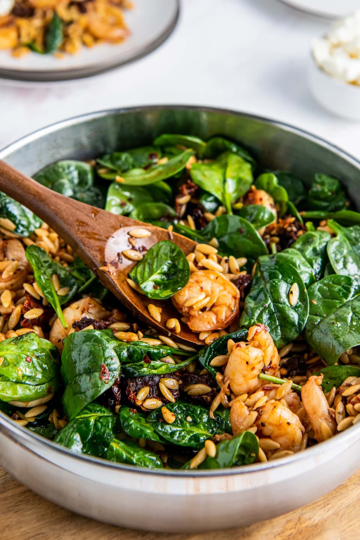 Shrimp and orzo salad with fresh spinach.