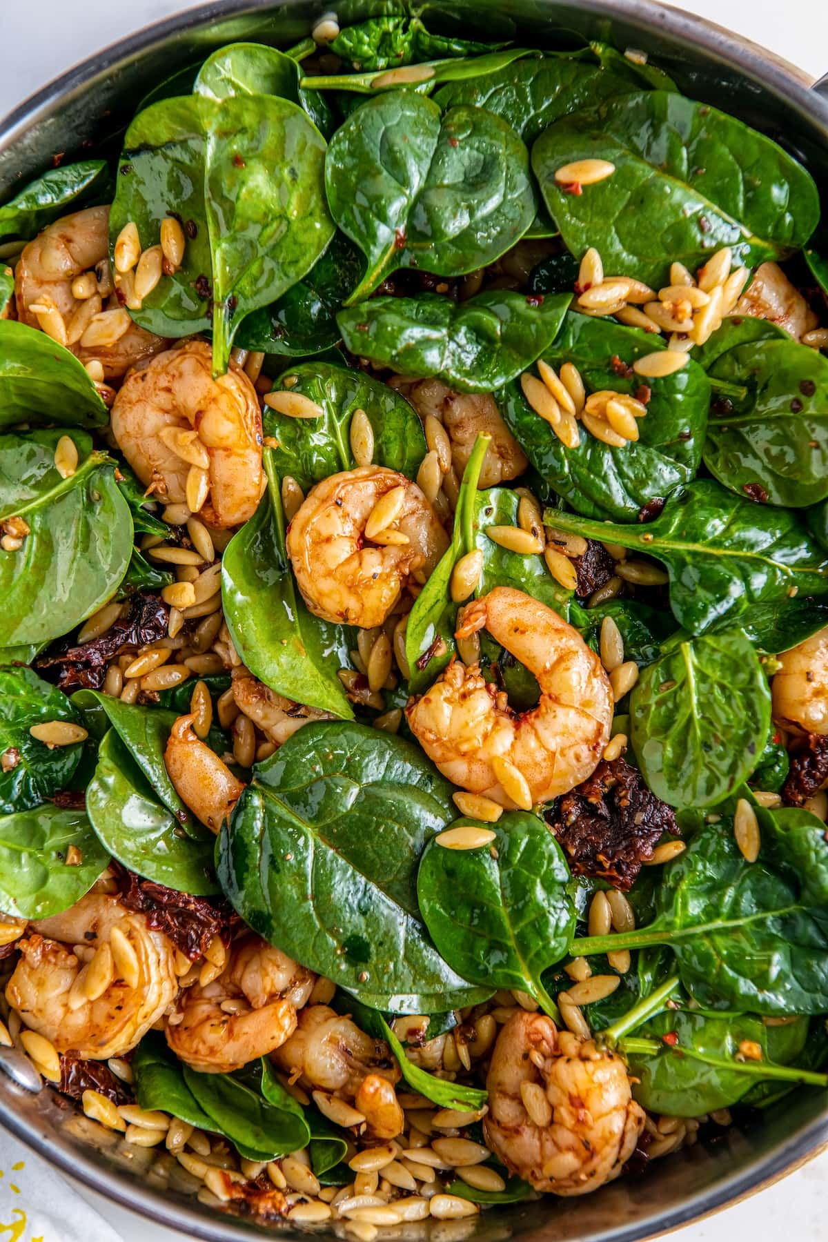 Shrimp salad with spinach, orzo, and sun-dried tomatoes.