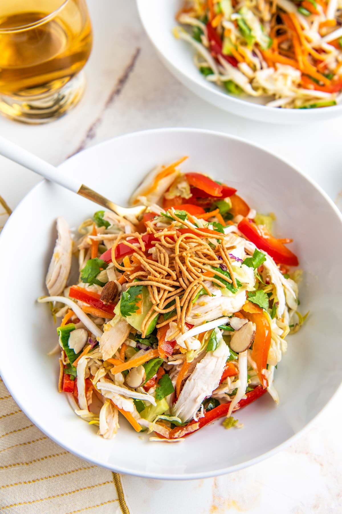 Asian chicken salad with fresh, chopped vegetables.