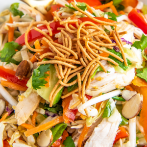 Asian chicken salad with chow mein noodles and fresh veggies.