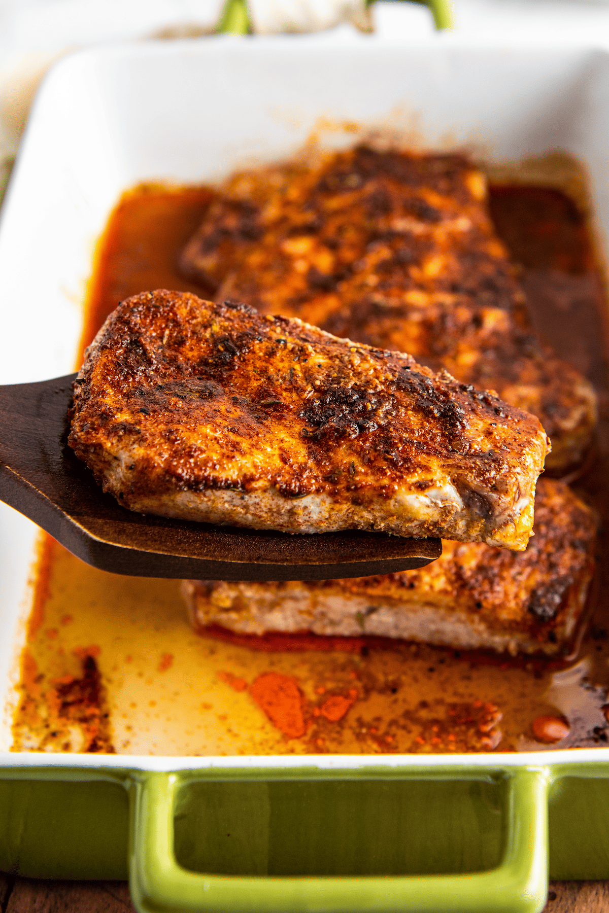 A piece of pork seasoned with a homemade pork rub.
