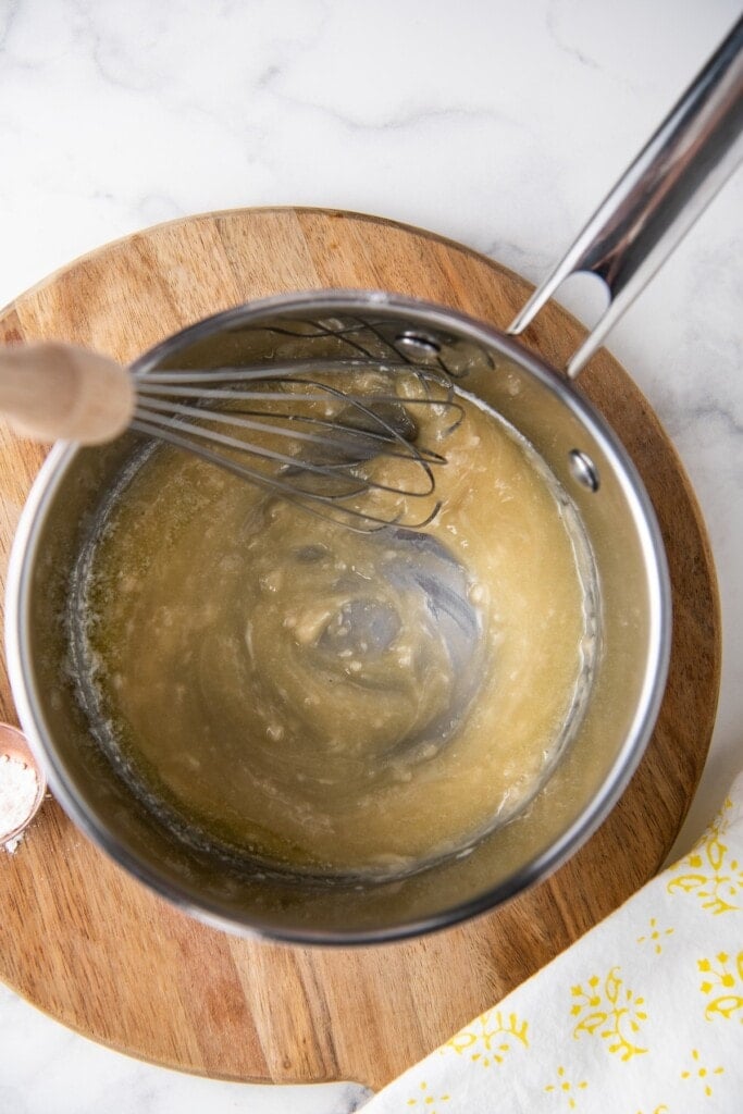 A roux, whisked together in a sauce pan.