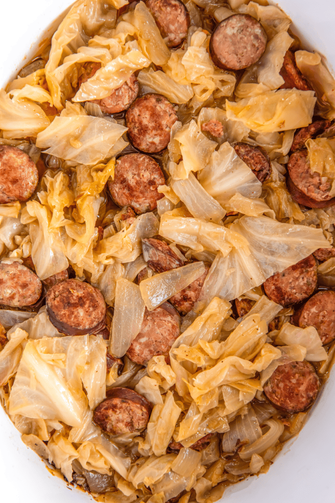Cooked sausage with chopped cabbage.