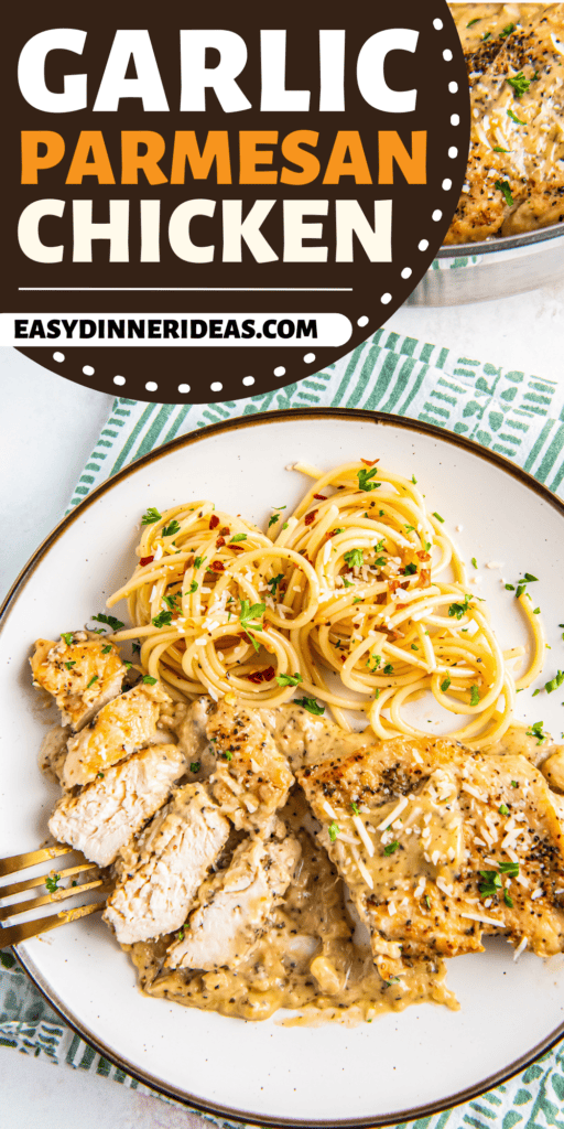 A plate with chicken in a garlic Parmesan sauce and noodles.