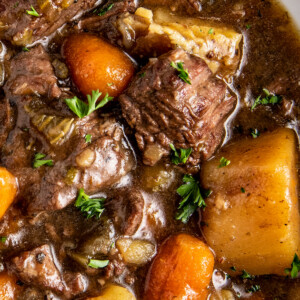 A bowl of instant pot beef stew with potatoes and carrots.