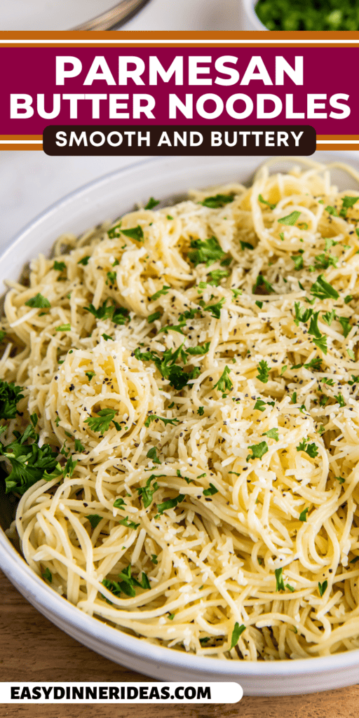 A bowl of Parmesan Butter Noodles with fresh herbs on top.