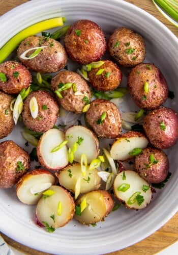 Roasted baby potatoes in a serving dish.