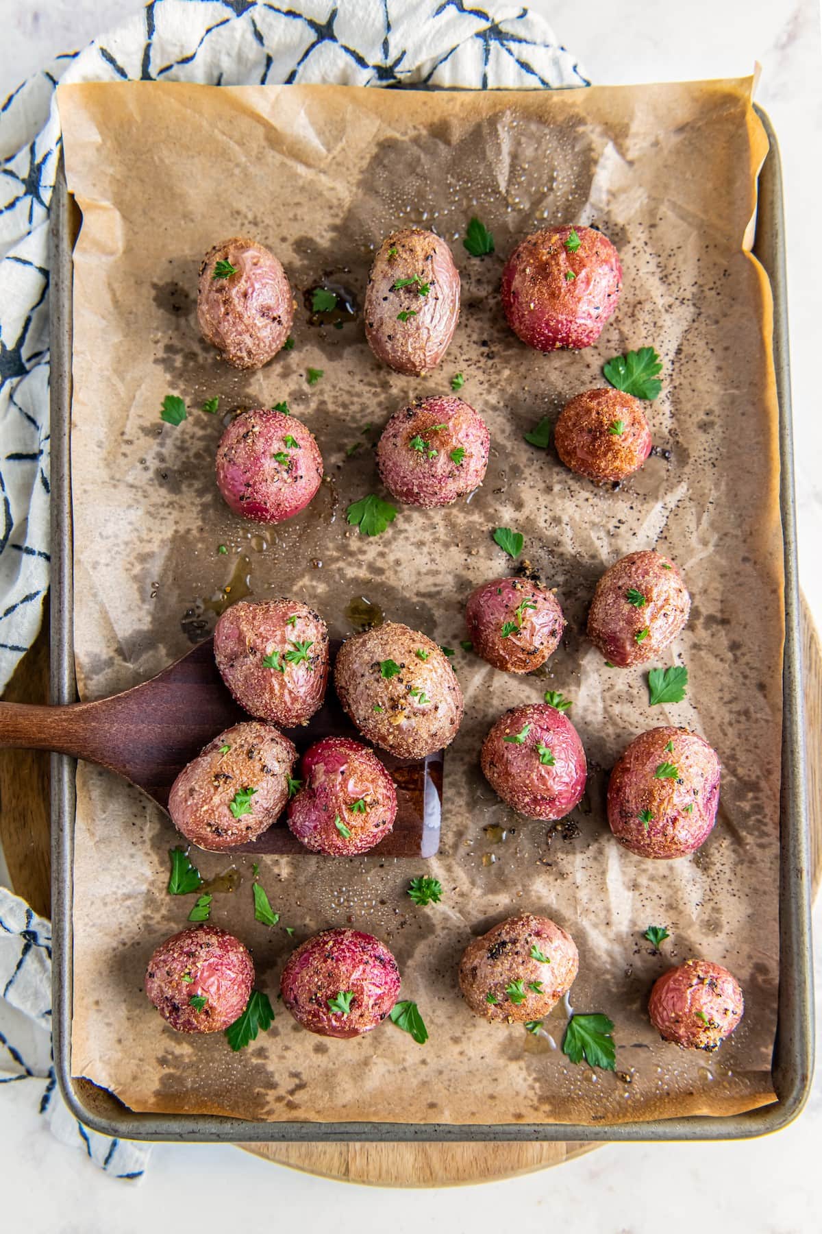 Roasted red potatoes with seasoning.