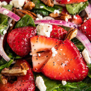 Spinach strawberry salad with poppy seed dressing.