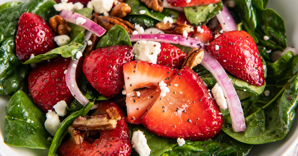 Spinach strawberry salad with poppy seed dressing.