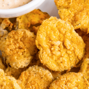 Close up overhead view of a plate full of fried pickles