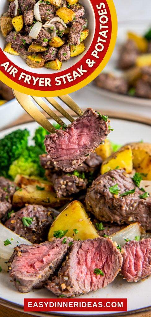 Air fryer steak bites and potatoes on a plate with a fork picking up a bite of steak that is cut in half.