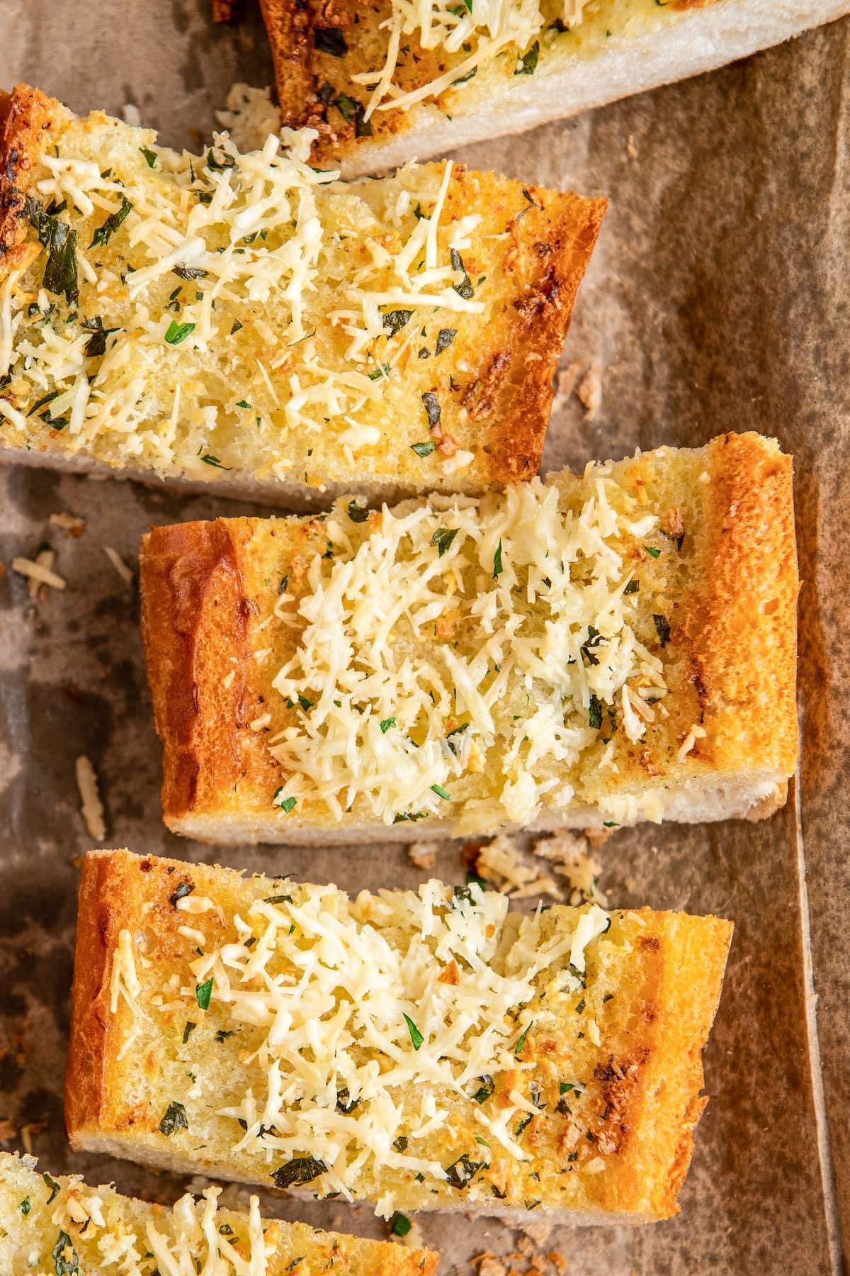 Overhead view of three slices of garlic bread