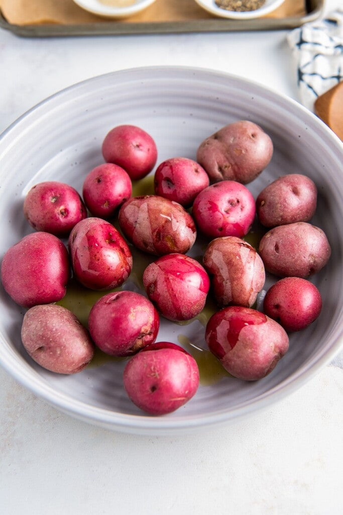 Red baby potatoes in a bowl.