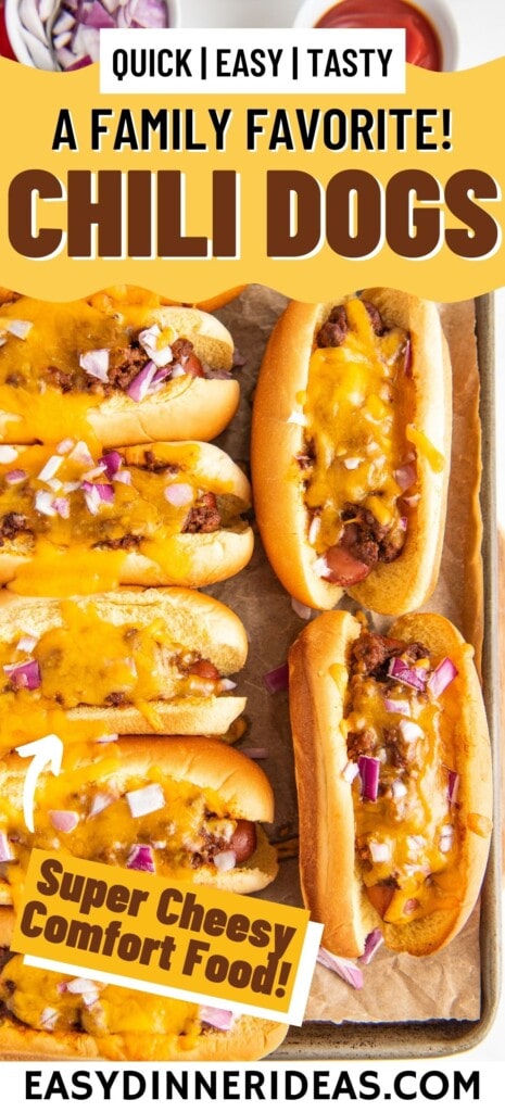 Chili cheese dogs on a baking sheet pan lined with parchment paper.