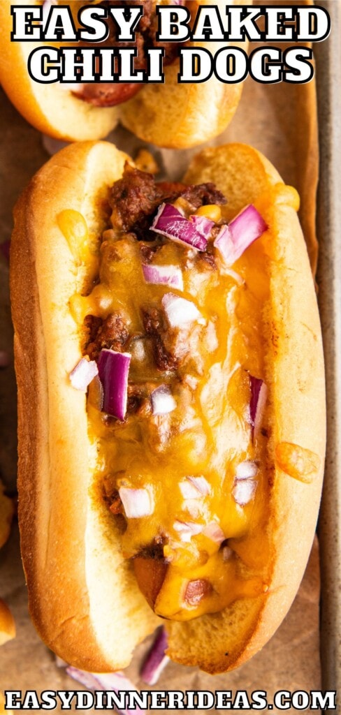 Baked chili cheese dog with red onions on top.