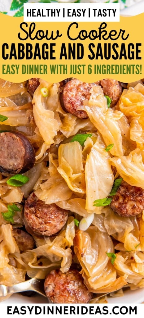 Slow cooker cabbage and sausage with green onions on top.
