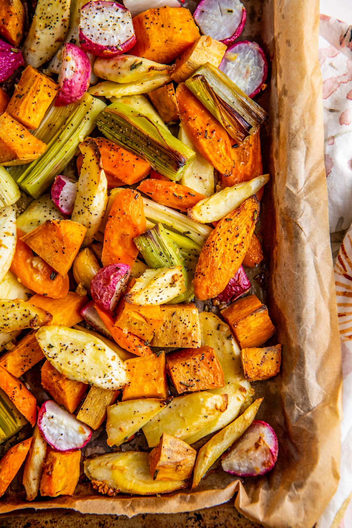Close up of roasted root veggies in a sheet pan