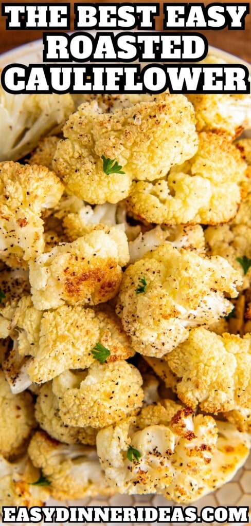 A bowl of roasted cauliflower with fresh parsley on top.