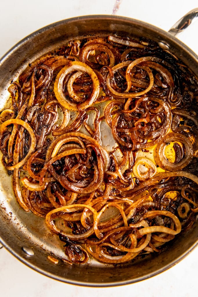 Cooking onions in a skillet.