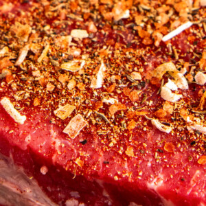 Close-ups shot of seasoning on a steak.