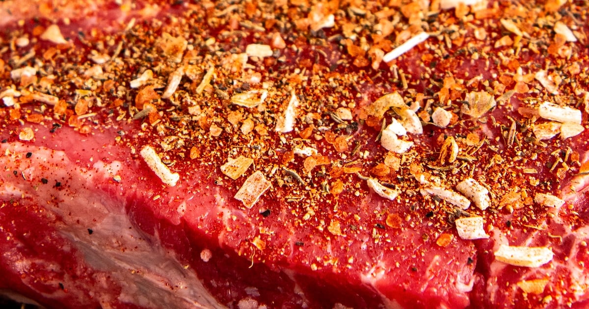 Close-ups shot of seasoning on a steak.