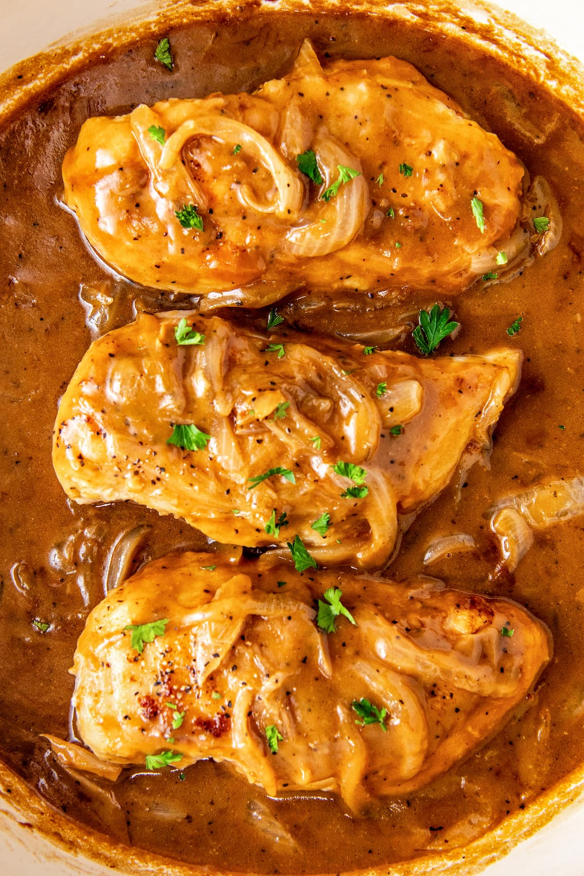 Three tender, smothered chicken breast in a rich and savory brown onion gravy.