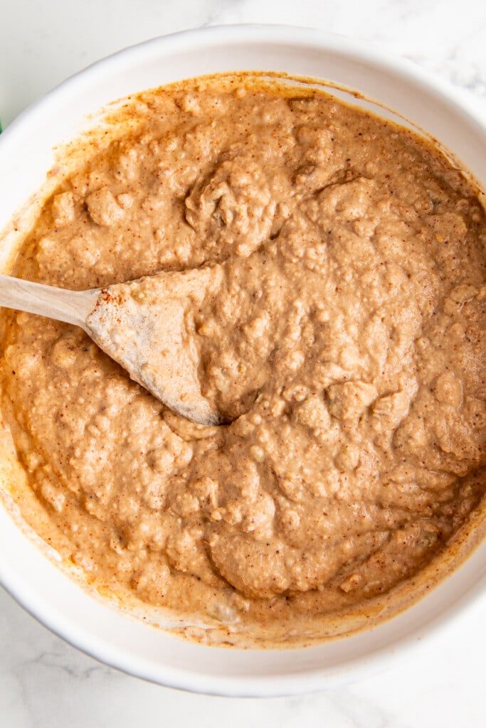 Bean dip fully mixed together in a white bowl.