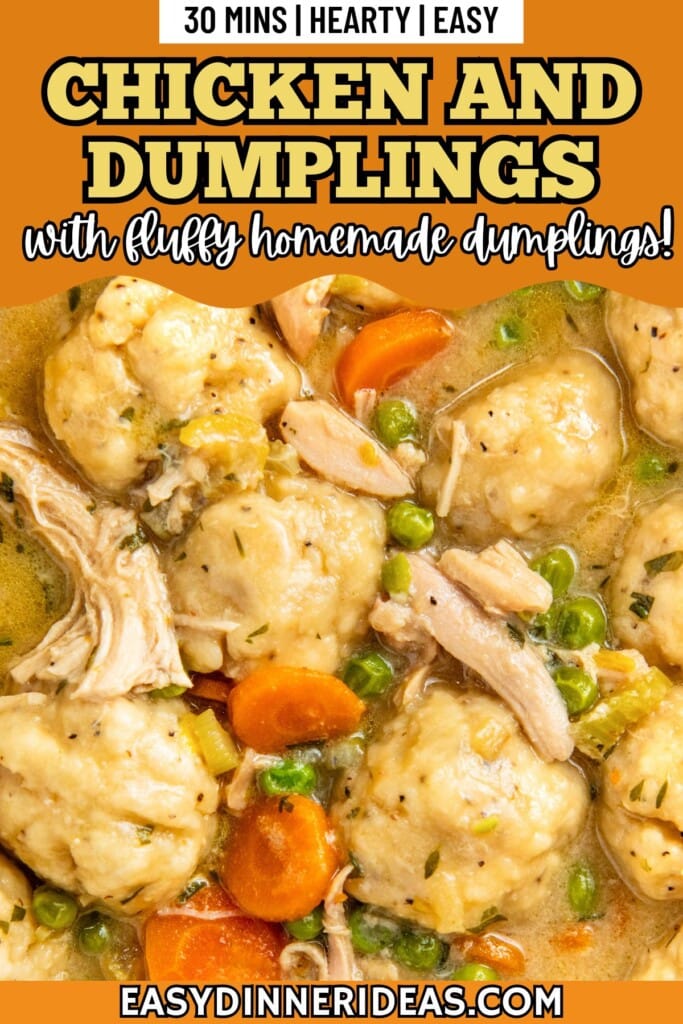 Fluffy drop dumplings floating in a pot of chicken and dumping soup with carrots and peas.