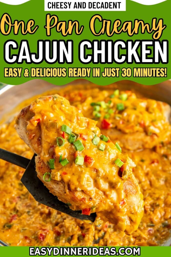 A skillet of creamy cajun chicken with a spatula lifting a chicken breast out of the pot.