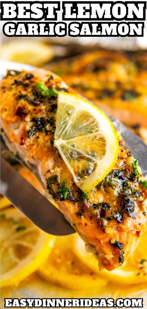 Lemon garlic salmon being lifted off a sheet pan with a spatula.