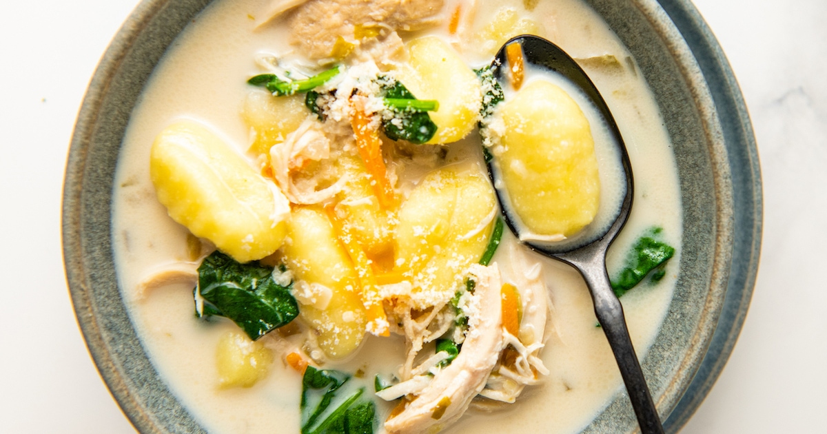 Closeup of a bowl of chicken and gnocchi soup.