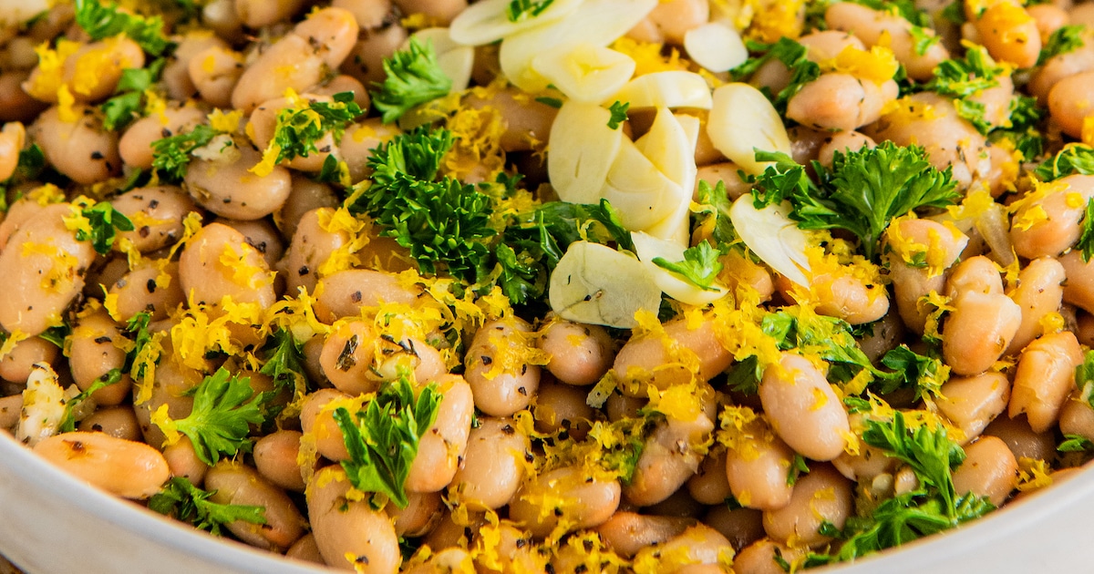 Close up of a bowl of white bean salad.