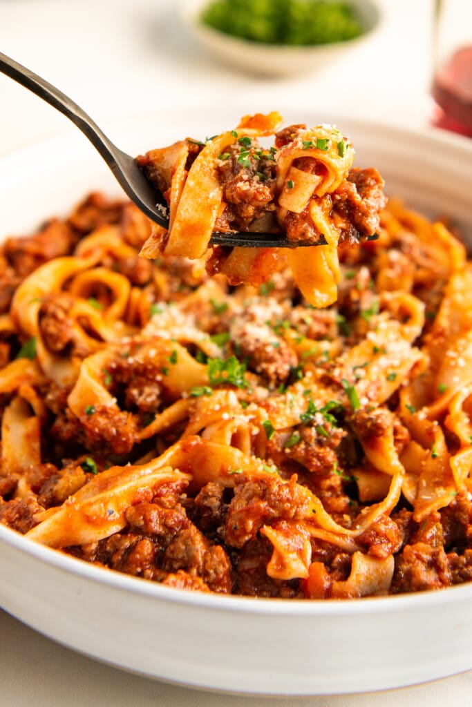 Close up of a bite of pasta with homemade spaghetti sauce.