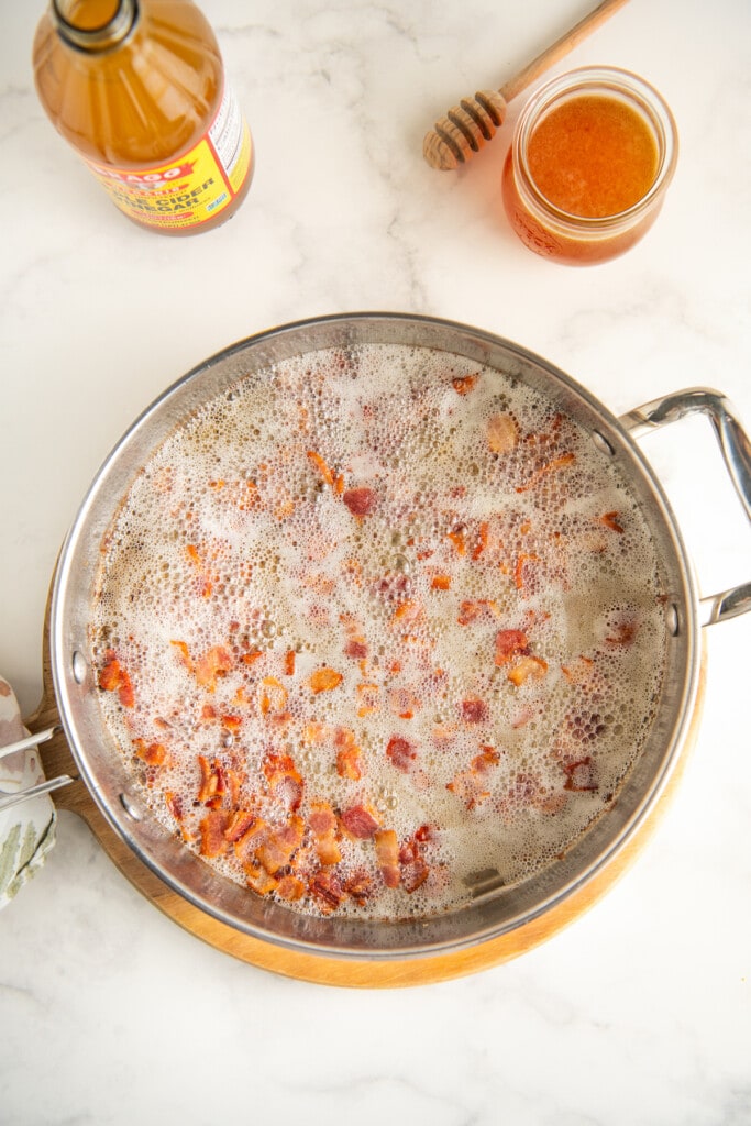 Cooking bacon in a pan.